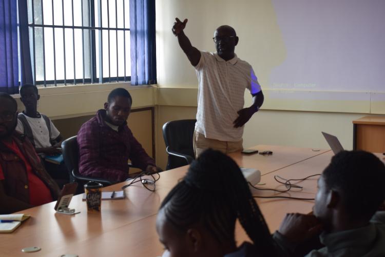 Prof. XN Iraki Welcoming a Business School Student to the Guest Lecture